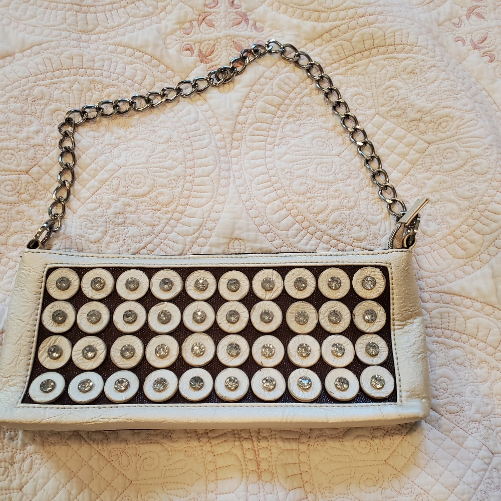 Small handbag cream and brown sequin accents with chain handle.